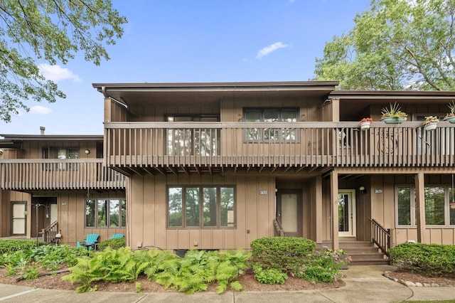 2671 Sumac Rdg, White Bear Lake, MN 55110 - view of front of house with a balcony and board and batten siding
