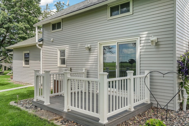 3820 8th St, Owatonna, MN 55060 - back of house with a wooden deck, a shingled roof, and a yard