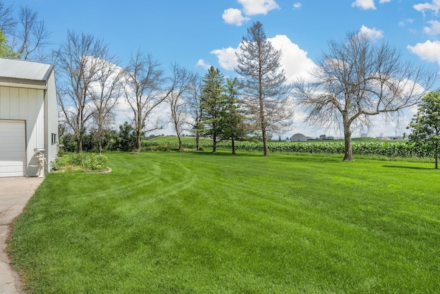 3820 8th St, Owatonna, MN 55060 - view of green lawn with a garage