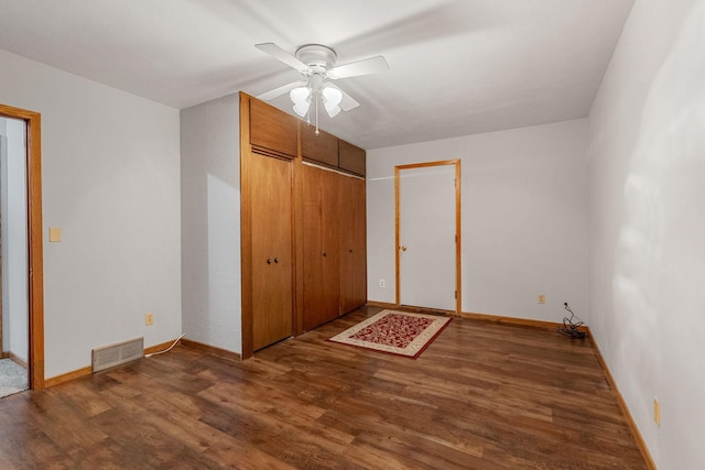 3820 8th St, Owatonna, MN 55060 - unfurnished bedroom with wood finished floors, ceiling fan, and a closet