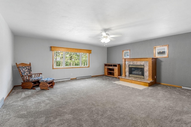 3820 8th St, Owatonna, MN 55060 - unfurnished room with carpet, ceiling fan, a fireplace, and a baseboard radiator
