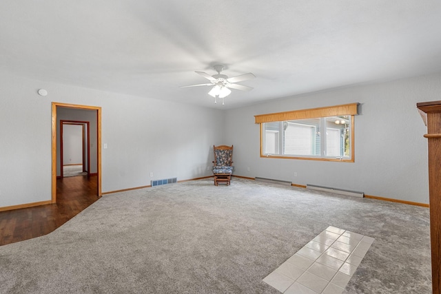 3820 8th St, Owatonna, MN 55060 - carpeted spare room featuring baseboard heating and ceiling fan