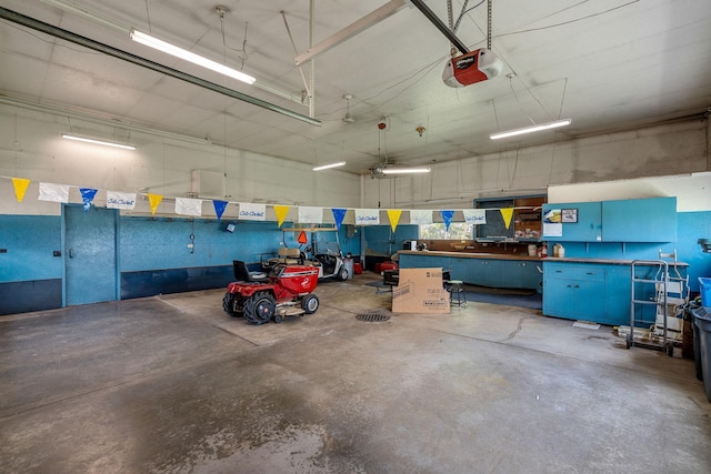 3820 8th St, Owatonna, MN 55060 - garage with a garage door opener and a workshop area