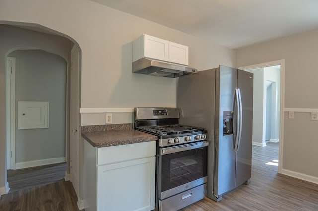 3410 Dupont Ave N, Minneapolis, MN 55412 - kitchen with stainless steel appliances, ventilation hood, dark countertops, and light wood-type flooring