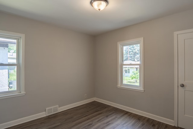 3410 Dupont Ave N, Minneapolis, MN 55412 - empty room featuring baseboards and dark wood-style flooring