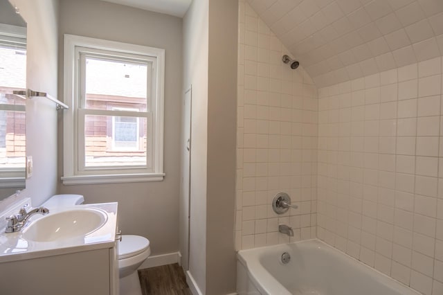 3410 Dupont Ave N, Minneapolis, MN 55412 - full bathroom with vanity, shower / washtub combination, wood finished floors, and lofted ceiling