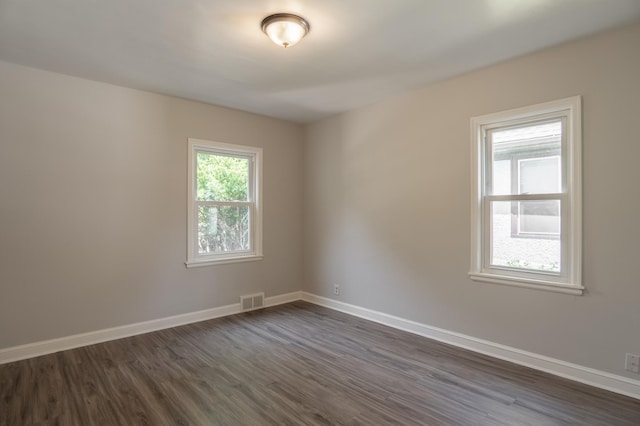 3410 Dupont Ave N, Minneapolis, MN 55412 - unfurnished room with dark wood-style floors and baseboards