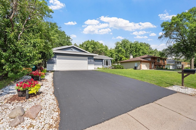 6502 Lancaster Ln N, Maple Grove, MN 55369 - view of front facade featuring a garage, a front lawn, and asphalt driveway
