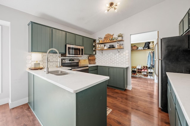 6502 Lancaster Ln N, Maple Grove, MN 55369 - kitchen with stainless steel appliances, green cabinets, backsplash, a peninsula, and lofted ceiling