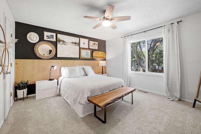 6502 Lancaster Ln N, Maple Grove, MN 55369 - carpeted bedroom with wooden walls and a ceiling fan