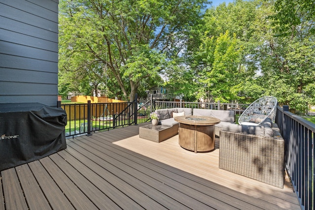 6502 Lancaster Ln N, Maple Grove, MN 55369 - wooden terrace with an outdoor living space with a fire pit and view of wooded area