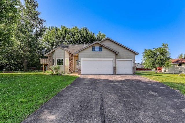 11883 Marigold Way, Lindstrom, MN 55045 - view of front facade with asphalt driveway, an attached garage, brick siding, and a front lawn
