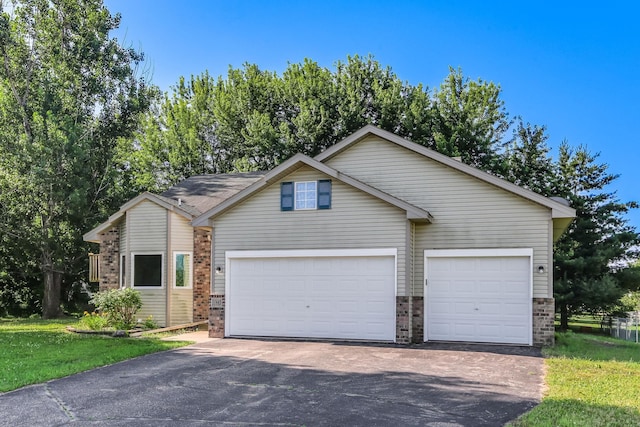 11883 Marigold Way, Lindstrom, MN 55045 - view of front of house featuring brick siding, asphalt driveway, and a garage