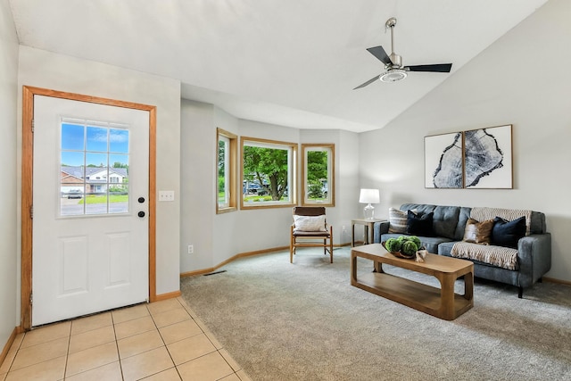 11883 Marigold Way, Lindstrom, MN 55045 - living room with light carpet, ceiling fan, vaulted ceiling, and light tile patterned flooring