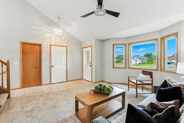 11883 Marigold Way, Lindstrom, MN 55045 - living room featuring light tile patterned floors, light colored carpet, ceiling fan, stairway, and high vaulted ceiling