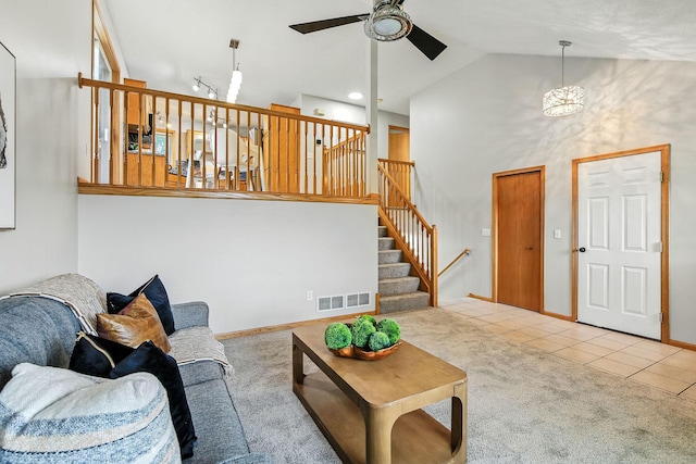11883 Marigold Way, Lindstrom, MN 55045 - carpeted living room featuring high vaulted ceiling, a ceiling fan, and tile patterned flooring