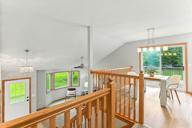11883 Marigold Way, Lindstrom, MN 55045 - hall featuring wood finished floors, lofted ceiling, and an upstairs landing