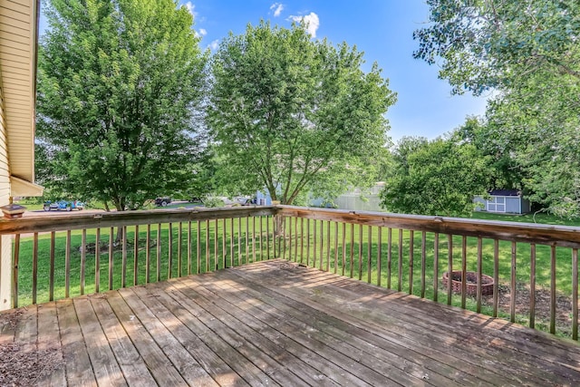 11883 Marigold Way, Lindstrom, MN 55045 - deck featuring a storage unit and a yard