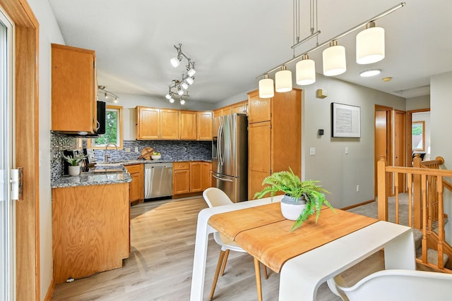 11883 Marigold Way, Lindstrom, MN 55045 - kitchen with stainless steel appliances, decorative backsplash, light wood-type flooring, light stone countertops, and decorative light fixtures