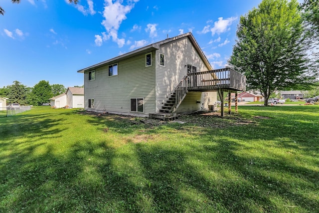 11883 Marigold Way, Lindstrom, MN 55045 - rear view of property featuring stairway, a wooden deck, and a yard