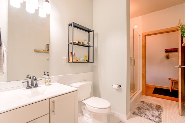521 2nd St SE Unit 307, Minneapolis, MN 55414 - bathroom featuring tile patterned floors, an enclosed shower, and vanity