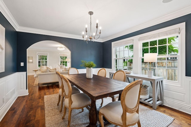4622 Drexel Ave, Edina, MN 55424 - dining space featuring arched walkways, wainscoting, a chandelier, ornamental molding, and a decorative wall