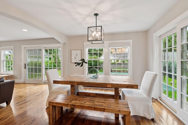 4622 Drexel Ave, Edina, MN 55424 - dining space featuring plenty of natural light, arched walkways, light wood finished floors, a chandelier, and recessed lighting