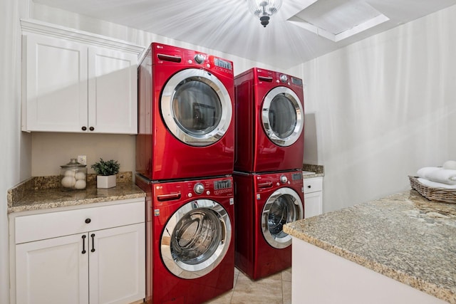 4622 Drexel Ave, Edina, MN 55424 - washroom featuring stacked washer and clothes dryer, cabinet space, and light tile patterned floors