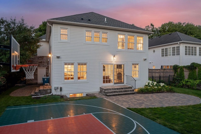 4622 Drexel Ave, Edina, MN 55424 - back of property at dusk with basketball court and a patio area