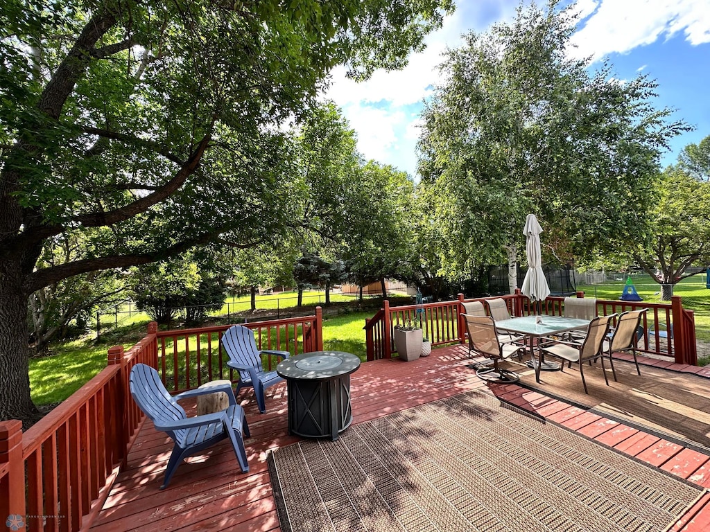 1908 23rd St S, Fargo, ND 58103 - wooden deck with outdoor dining space