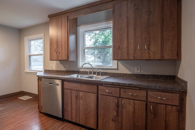 3708 Xenia Ave N, Crystal, MN 55422 - kitchen with dishwasher, dark countertops, dark wood-style flooring, and healthy amount of natural light