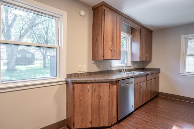 3708 Xenia Ave N, Crystal, MN 55422 - kitchen featuring dishwasher, dark countertops, wood finished floors, and brown cabinetry