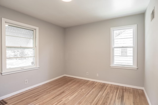 3708 Xenia Ave N, Crystal, MN 55422 - unfurnished room with healthy amount of natural light and light wood-style flooring