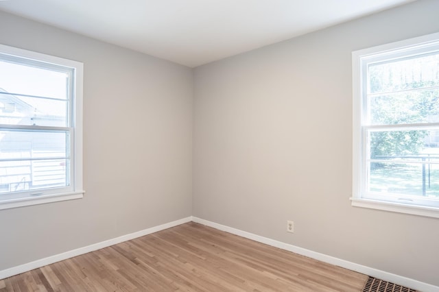 3708 Xenia Ave N, Crystal, MN 55422 - unfurnished room featuring light wood-style floors and plenty of natural light