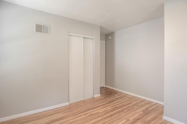 3708 Xenia Ave N, Crystal, MN 55422 - unfurnished bedroom featuring light wood-style flooring and a closet