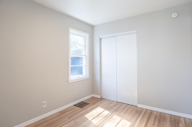 3708 Xenia Ave N, Crystal, MN 55422 - unfurnished bedroom with light wood-style flooring and a closet