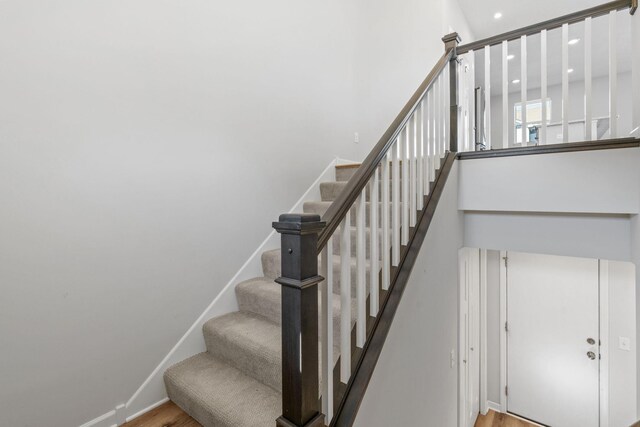 7614 Connie Ln, Inver Grove Heights, MN 55076 - stairway with wood finished floors and recessed lighting