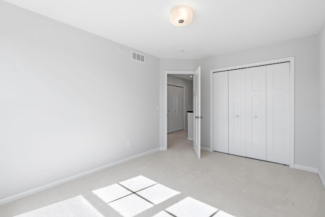 7614 Connie Ln, Inver Grove Heights, MN 55076 - unfurnished bedroom featuring light carpet and a closet