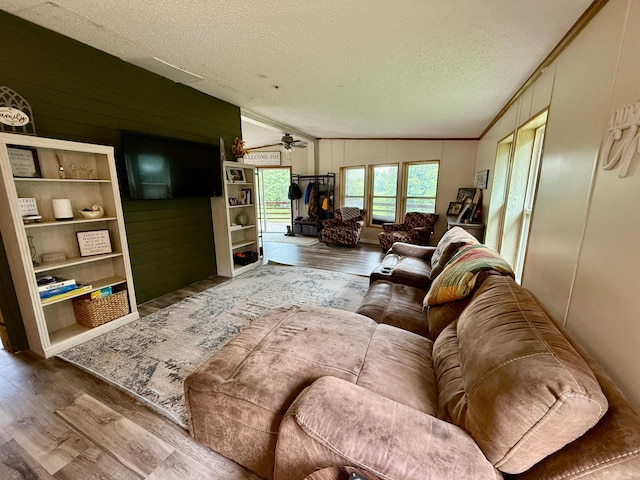 656 22nd Ave NW, Baudette Twp, MN 56623 - living area with wood finished floors, a textured ceiling, ceiling fan, and ornamental molding