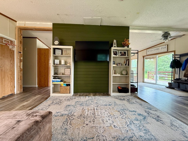 656 22nd Ave NW, Baudette Twp, MN 56623 - living area featuring a textured ceiling, wood finished floors, and ceiling fan