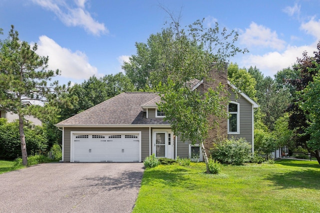 14170 Westridge Dr, Eden Prairie, MN 55347 - view of front of home with a garage, asphalt driveway, a front yard, a chimney, and roof with shingles