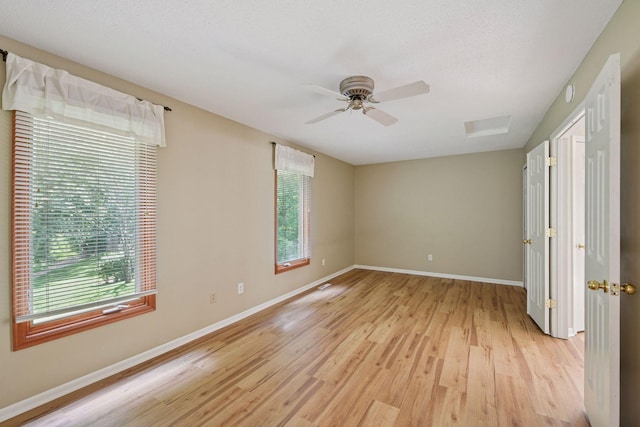 14170 Westridge Dr, Eden Prairie, MN 55347 - unfurnished bedroom with light wood-style floors and a ceiling fan