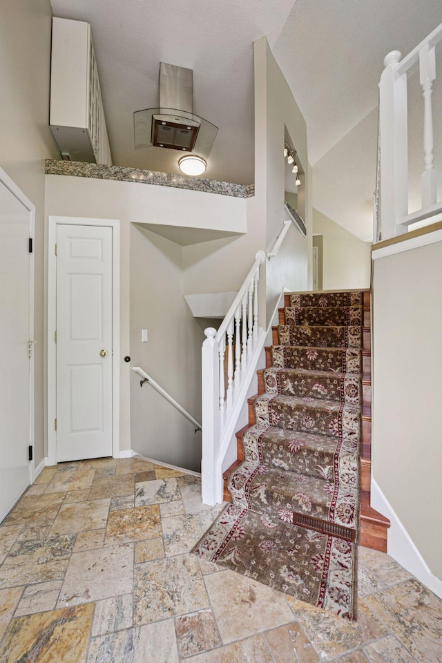 14170 Westridge Dr, Eden Prairie, MN 55347 - stairway with stone tile flooring and vaulted ceiling