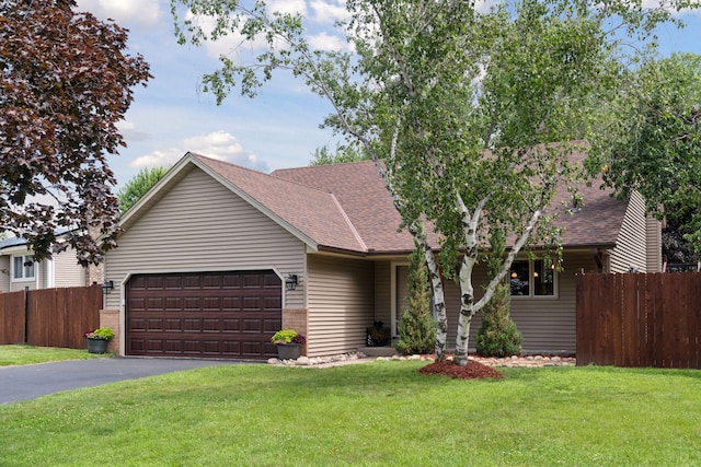 549 Vicki Ln, Shoreview, MN 55126 - view of front of house with a shingled roof, an attached garage, and asphalt driveway
