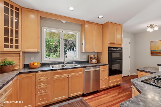 549 Vicki Ln, Shoreview, MN 55126 - kitchen featuring stainless steel appliances, light wood-style floors, dark countertops, light brown cabinets, and glass insert cabinets