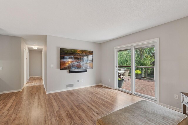 549 Vicki Ln, Shoreview, MN 55126 - unfurnished living room featuring wood finished floors and baseboards