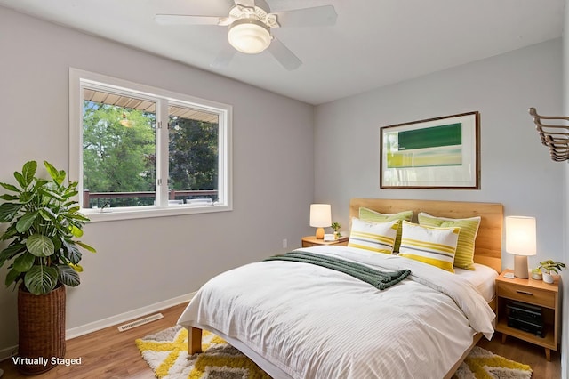 549 Vicki Ln, Shoreview, MN 55126 - bedroom featuring wood finished floors and a ceiling fan