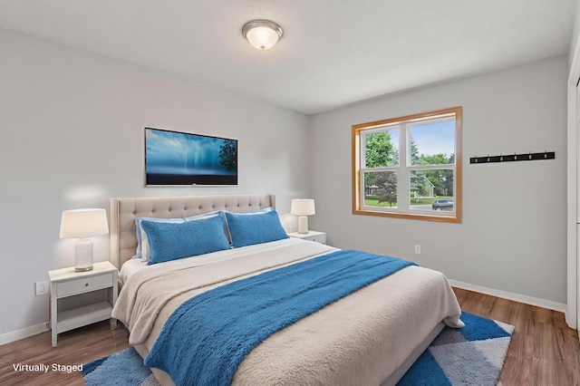 549 Vicki Ln, Shoreview, MN 55126 - bedroom featuring baseboards and wood finished floors