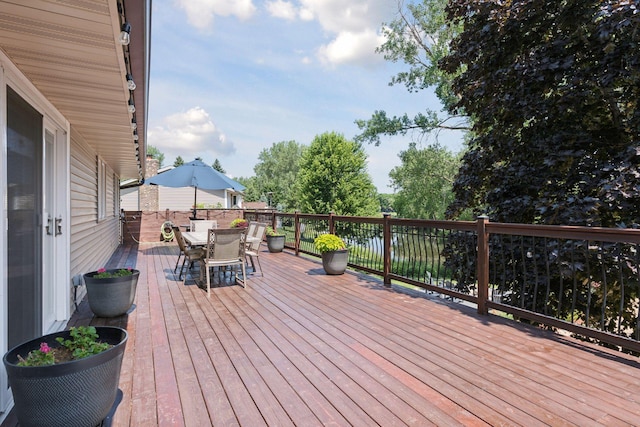 549 Vicki Ln, Shoreview, MN 55126 - wooden deck featuring outdoor dining area