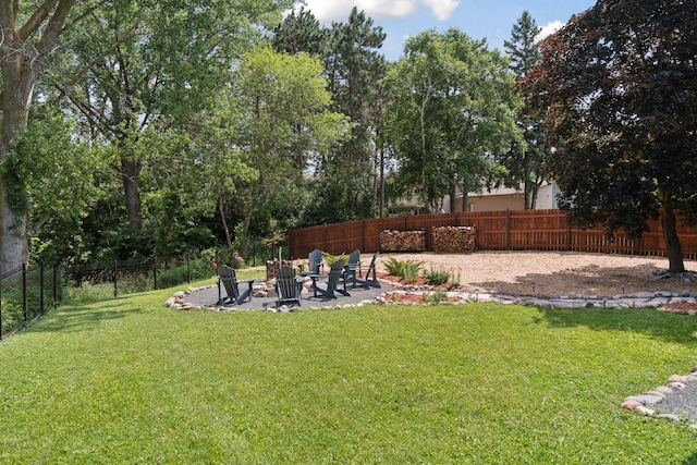 549 Vicki Ln, Shoreview, MN 55126 - fenced backyard with an outdoor fire pit and a patio